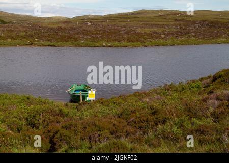 Barca a remi a Loch Druidibeag, South Uist, Ebridi esterne Foto Stock