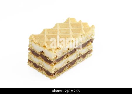 Quattro strati di vaniglia e crema al cioccolato in un pezzo di dessert fatto in casa Foto Stock