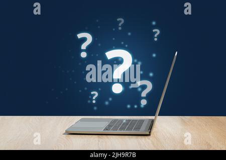 Concetto del punto interrogativo o FAQ. Firma olografica su laptop. Foto Stock