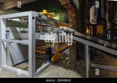 Confezionatrice, insaccatrice e impilatrice di cemento Foto Stock