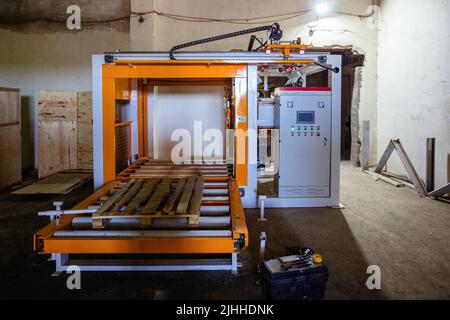Confezionatrice, insaccatrice e impilatrice di cemento Foto Stock