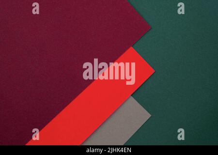 Fogli di carta rossa, verde e grigia, tavolozza di carta colorata. Carta astratta sfondo colorato. Morbido color pastello spazio vuoto per il testo. Geometrico Foto Stock