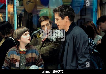 NICHOLAS HOULT, TONI COLLETTE, Hugh Grant, SU UN RAGAZZO, 2002 Foto Stock