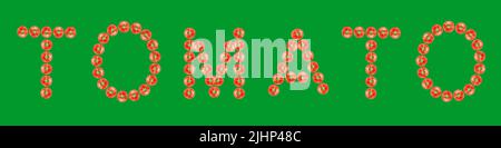 Testo POMODORO fatto da piccoli pomodori ciliegia isolato su sfondo verde. Foto Stock