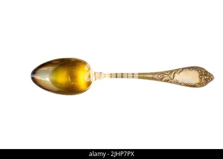 Olio d'oliva. Olio d'oliva spagnolo in recipiente trasparente di vetro con pomodoro. Primo piano, isolato su sfondo bianco. Foto Stock