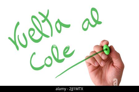 Scrivere a mano in aria sullo schermo Vuelta al cole con un marcatore verde con fondo bianco isolato Foto Stock