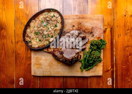 Cena arrosto di agnello Foto Stock