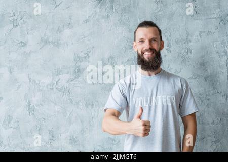 volontariato responsabile stile di vita uomo pollice in su Foto Stock