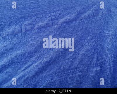 Un bel sfondo di tessuto blu Foto Stock