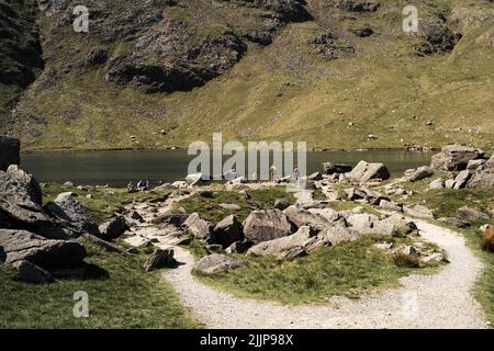 The Levers Water below the Old Man of Coniston on a sunny day in the Lake District in England Stock Photo