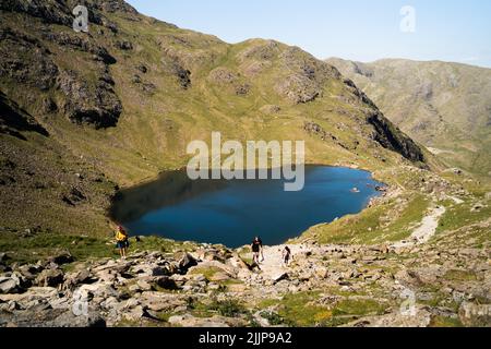The Levers Water below the Old Man of Coniston on a sunny day in the Lake District in England Stock Photo