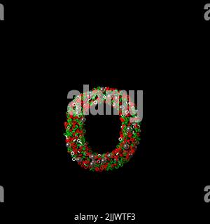 Sparso verde e rosso Natale come carattere isolato su uno sfondo nero Foto Stock