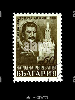 Spasski Tower e Joseph Stalin, famoso leader politico sovietico, circa 1948. Il monumento commemorativo dell'esercito sovietico. Timbro postale vintage della Bulgaria isolato Foto Stock