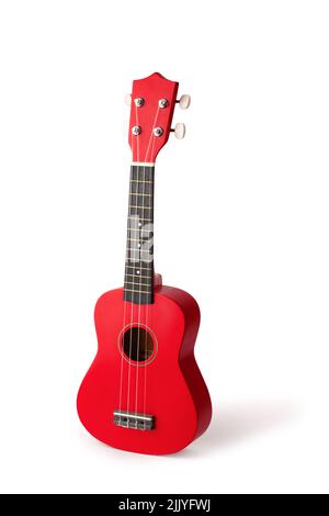 La chitarra rossa ukulele hawaiana è isolata su sfondo bianco Foto Stock