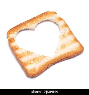 Pane tostato con segni del grill e foro a forma di cuore isolato su sfondo bianco Foto Stock