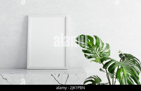 Cornice fotografica vuota mockup su tavola di marmo bianco con pianta di formaggio svizzera in primo piano su fondo di cemento. Arte e arredamento per la casa. 3D Foto Stock