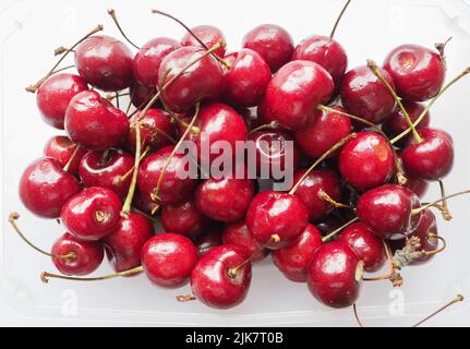 Rosso ciliegia nome scientifico Prunum vegetariano frutta alimentare Foto Stock