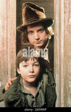 Alex Trench & Elia Wood Film: Oliver Twist (1997) personaggi: Oliver Twist & The Artful Dodger regista: Tony Bill 16 Novembre 1997 **ATTENZIONE** questa foto è solo per uso editoriale ed è copyright DI DISNEY e/o del fotografo assegnato dalla Film o dalla Società di produzione e può essere riprodotta solo da pubblicazioni in concomitanza con la promozione del suddetto Film. È richiesto un credito obbligatorio per DISNEY. Il fotografo deve essere accreditato anche quando è noto. Nessun uso commerciale può essere concesso senza l'autorizzazione scritta della Film Company. Foto Stock