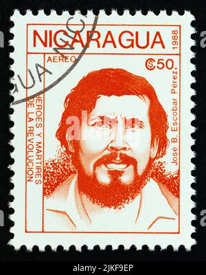 NICARAGUA - CIRCA 1988: Un francobollo stampato in Nicaragua dal numero 'rivoluzionari' mostra Jose B. Escobar Perez, circa 1988. Foto Stock