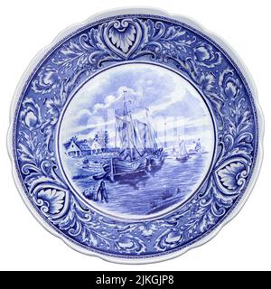 Vecchio piatto in ceramica blu e bianco con motivi olandesi come souvenir Foto Stock