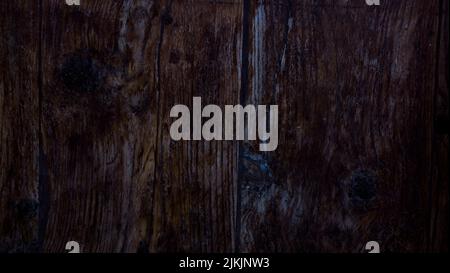 Un primo piano di una texture di pannelli di legno scuro Foto Stock