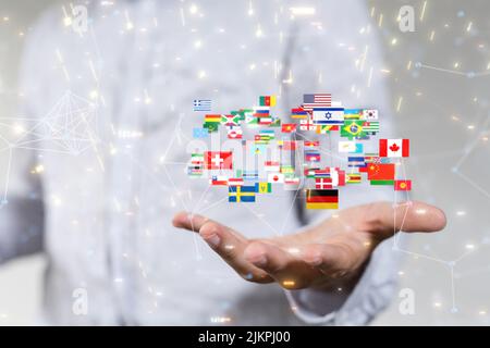 Una rappresentazione 3D di bandiere internazionali e connessioni neurali che galleggiano sopra una mano Foto Stock