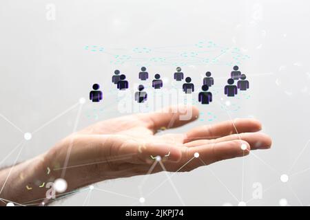 Un rendering 3D di un gruppo di icone fluttuanti di persone sulla mano di un uomo d'affari Foto Stock