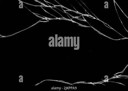 Arte di rughe e crepe del vetro causato da smashing e caduta di dossi. isolato su sfondo nero Foto Stock