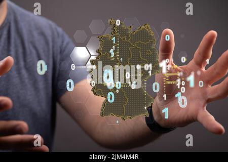 Un rendering 3D di una mappa tedesca che levita tra le mani di una persona Foto Stock