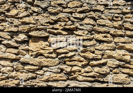 Parete di conchiglia di pietre grezze Foto Stock