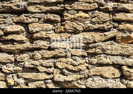 Parete di conchiglia di pietre grezze Foto Stock