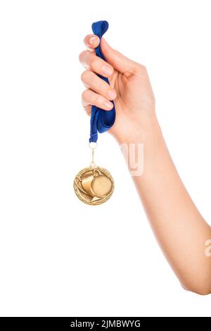 Ragazza mano alzata tenendo medaglia d'oro Foto Stock