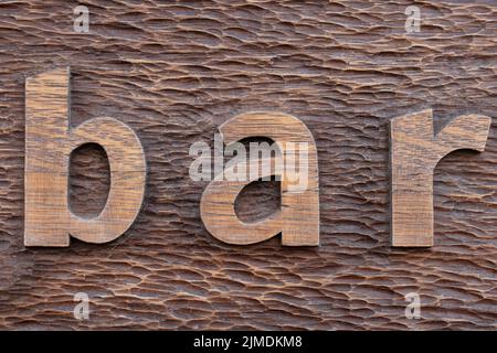 Vecchia struttura di legno intagliato. Barra di parola Foto Stock