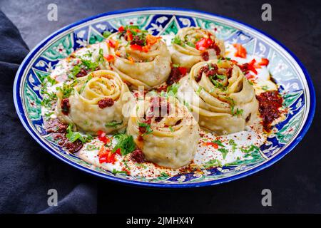 Tradizionale afghano Ay khanom al vapore con mincemeat Foto Stock