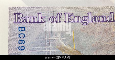 Frammento di banconote da venti sterline britanniche con segno Bank of England closeup. Foto Stock