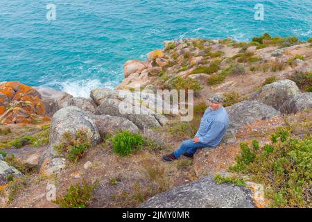 Andrew McIntyre, residente ad Adelaide in South Australia, è stato raffigurato presso il promontorio Rosetta Head sulla Encounter Bay a Victor Harbor, South Australia. Foto Stock