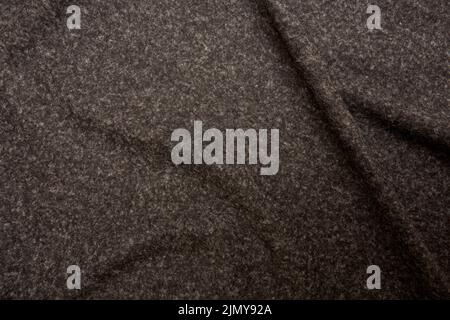 feltro grigio piegato con una struttura grossolana Foto Stock