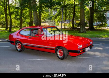 1986, 80s, ottanta rosso FORD CAPRI 1993cc benzina British fastback coupé; automobili e motociclette in mostra al Lytham Hall Summer Classic Car & Motorcycle Show 13th, un Classic Vintage Collectible Transport Festival. Foto Stock