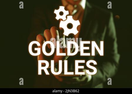 Scrittura a mano segno Golden Rules. Approccio aziendale principio di base che dovrebbe essere seguito principio importante Man Holding Tablet e puntare con uno Foto Stock