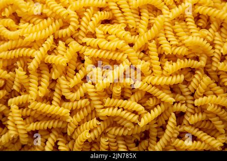 Girandole secche non cotte di fondo pasta Foto Stock
