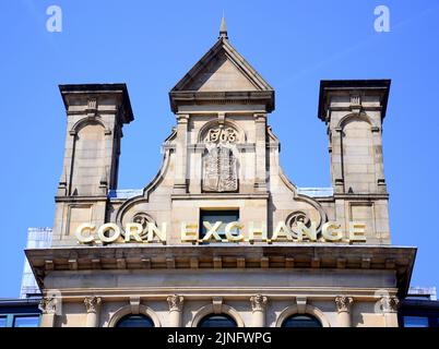 Un cartello o un logo esterno sul Corn Exchange, un edificio classificato di II livello, nel centro di Manchester, Regno Unito, Isole Britanniche. Foto Stock