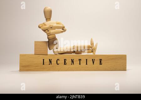 Incentivo scritto su superficie di legno. Motivazione e sviluppo personale Foto Stock
