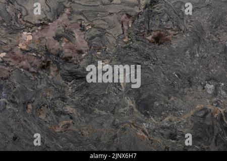 Sfondo in granito invecchiato in alta marea, texture scura per il design degli interni. Foto Stock