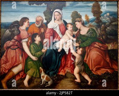 La Sacra Famiglia con Tobias e l'Angelo, Ste. Dorothy, e il Bambino Giovanni Battista, attribuito a Bonifacio de' Pitati, chiamato Bonifacio Veronese, a metà del 1500s Foto Stock