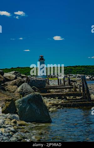 Faro di Maugers Beach sull'isola di McNabs, Halifax, Nuova Scozia Canada Foto Stock