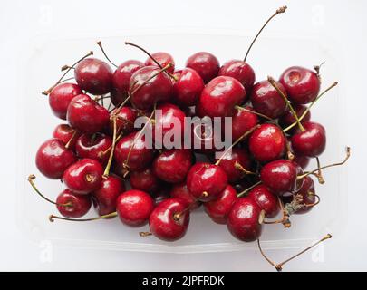 Rosso ciliegia nome scientifico Prunum vegetariano frutta alimentare Foto Stock