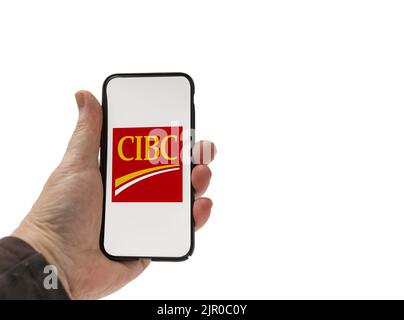 Cardiff Mid Glamorgan UK Agosto 20 2022 persona con cellulare con logo CIBC su sfondo bianco Foto Stock
