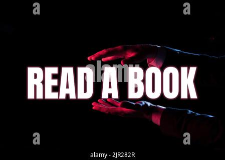Didascalia di testo Presentazione leggere Un libro. Parola scritta su godersi la letteratura attività tradizionale imparare nuove cose uomo d'affari presentazione importante Foto Stock