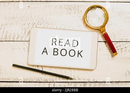 Didascalia di testo Presentazione leggere Un libro. Foto concettuale Godetevi la letteratura attività tradizionale imparare cose nuove schermo del tablet con nuove idee con Foto Stock