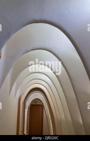 A vertical shot of the interesting interior of Casa Mila with arched cellings in Barcelona, Spain Stock Photo